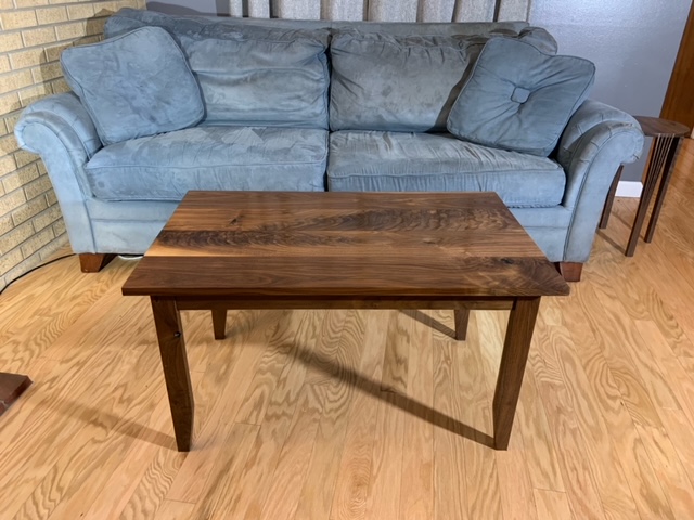 coffee table in front of a blue couch